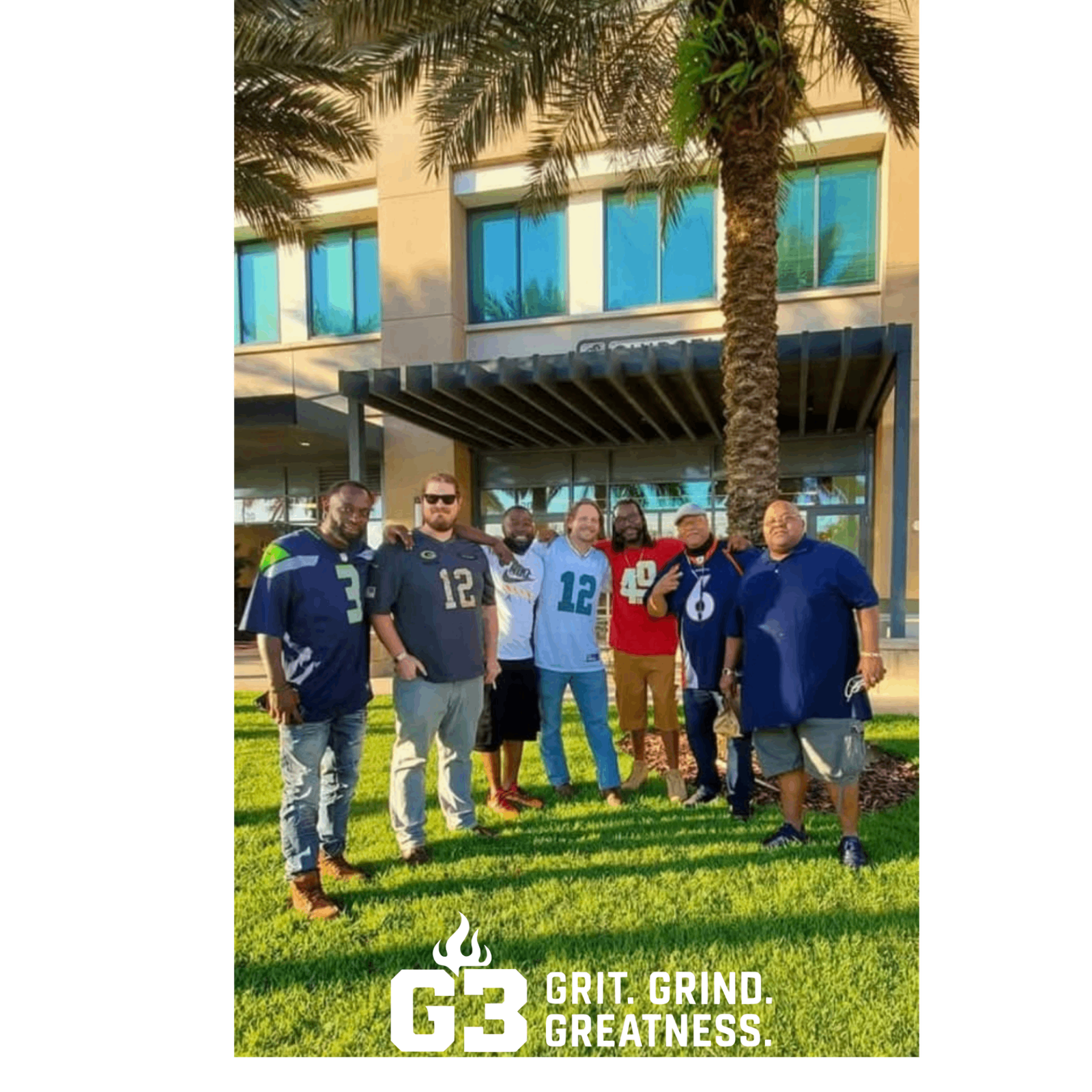 G3 members outdoors under palm trees