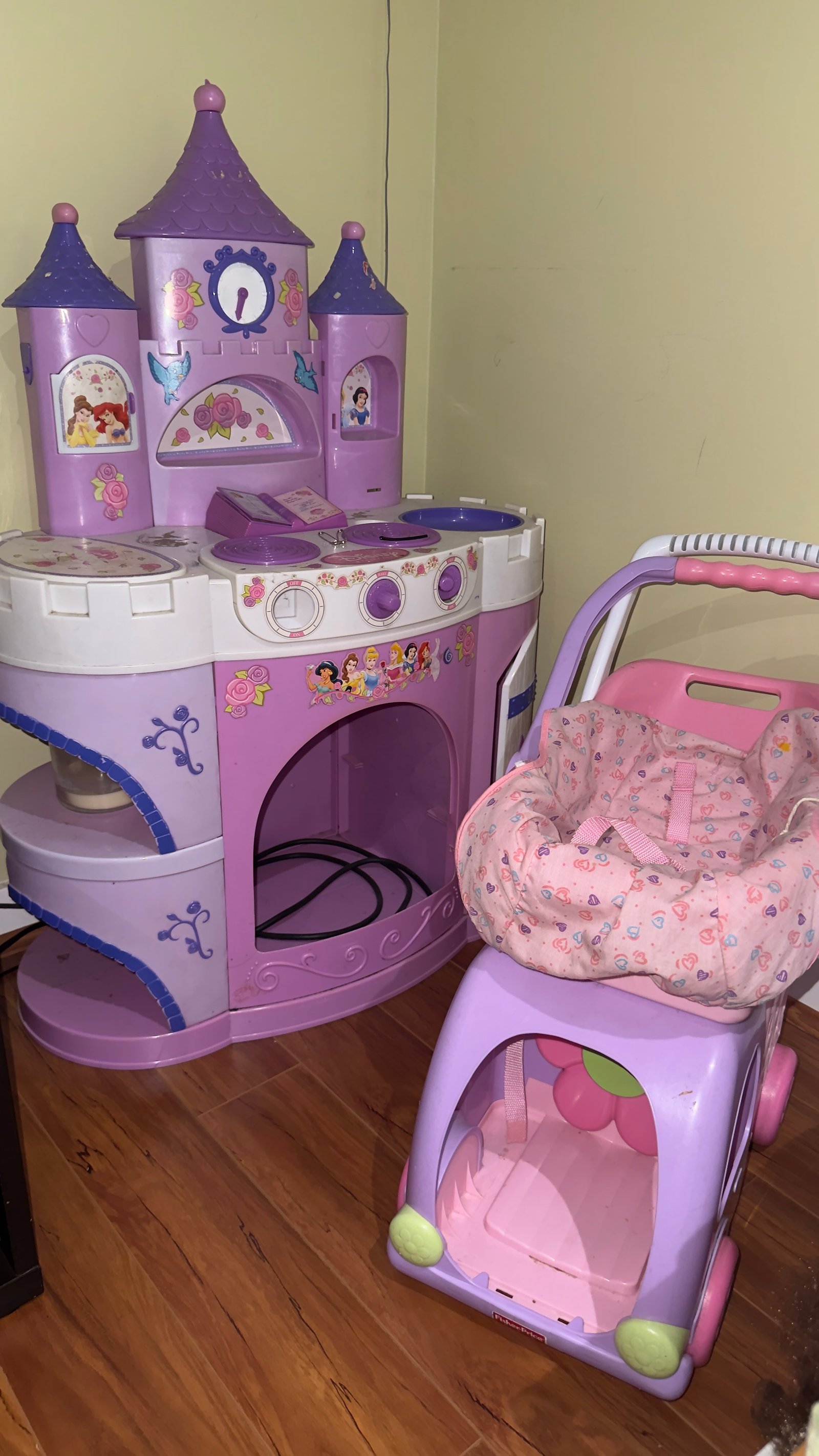 Purple castle kitchen set and pink doll stroller for imaginative play