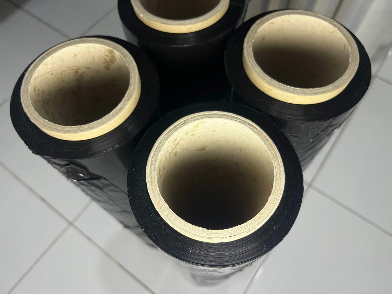 Comparison of JFAM Packaging clear and black stretch film rolls