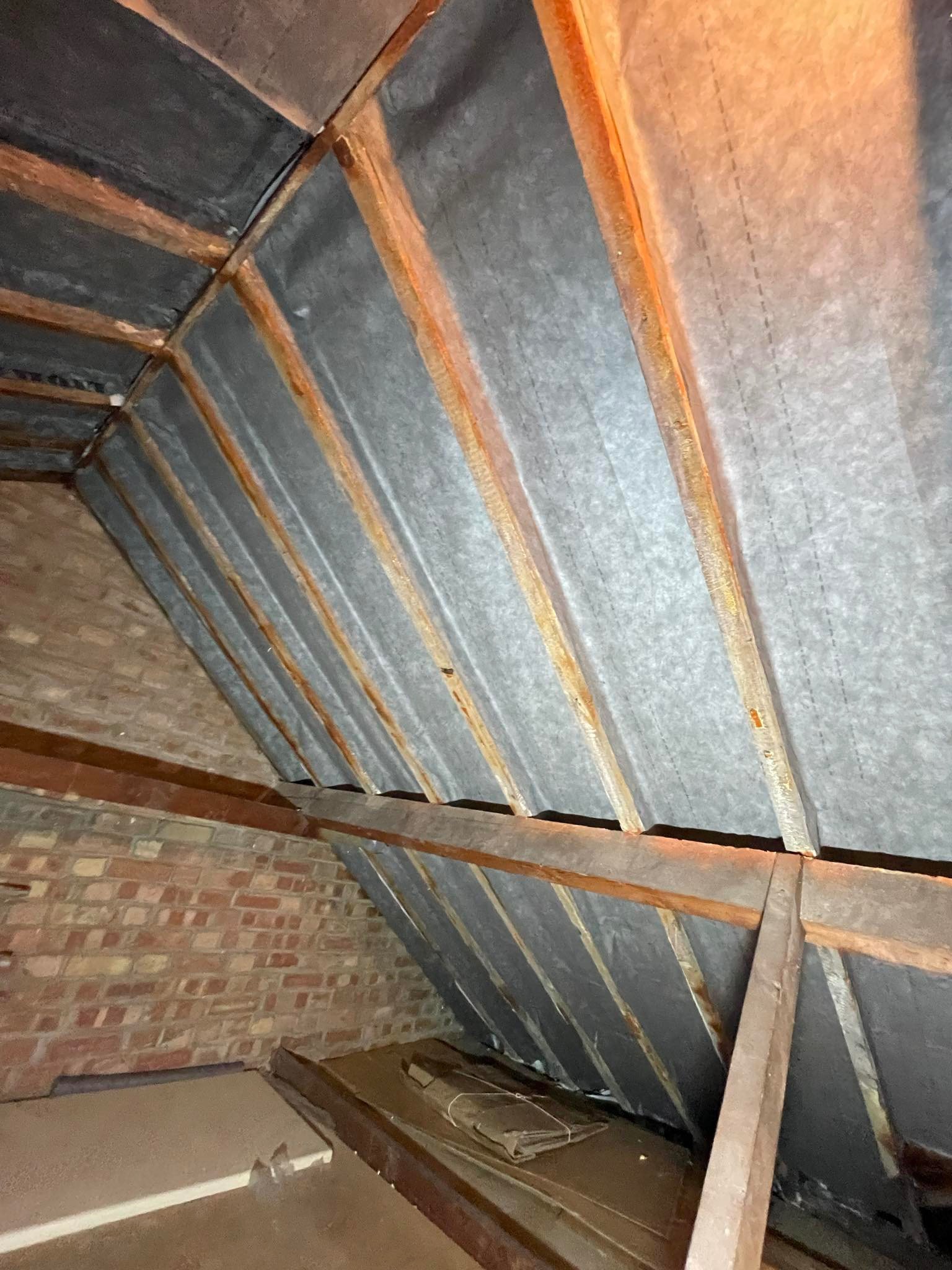 Protective underlay felt membrane fitted beneath a roof covering