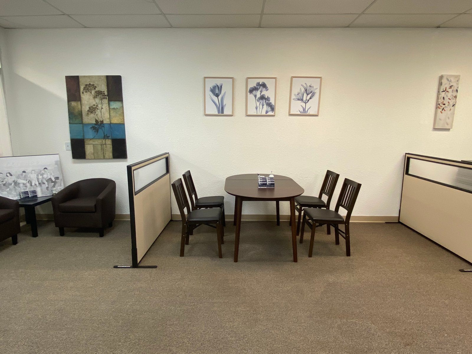The Leaders Tax office seating area with client chairs and framed artwork.