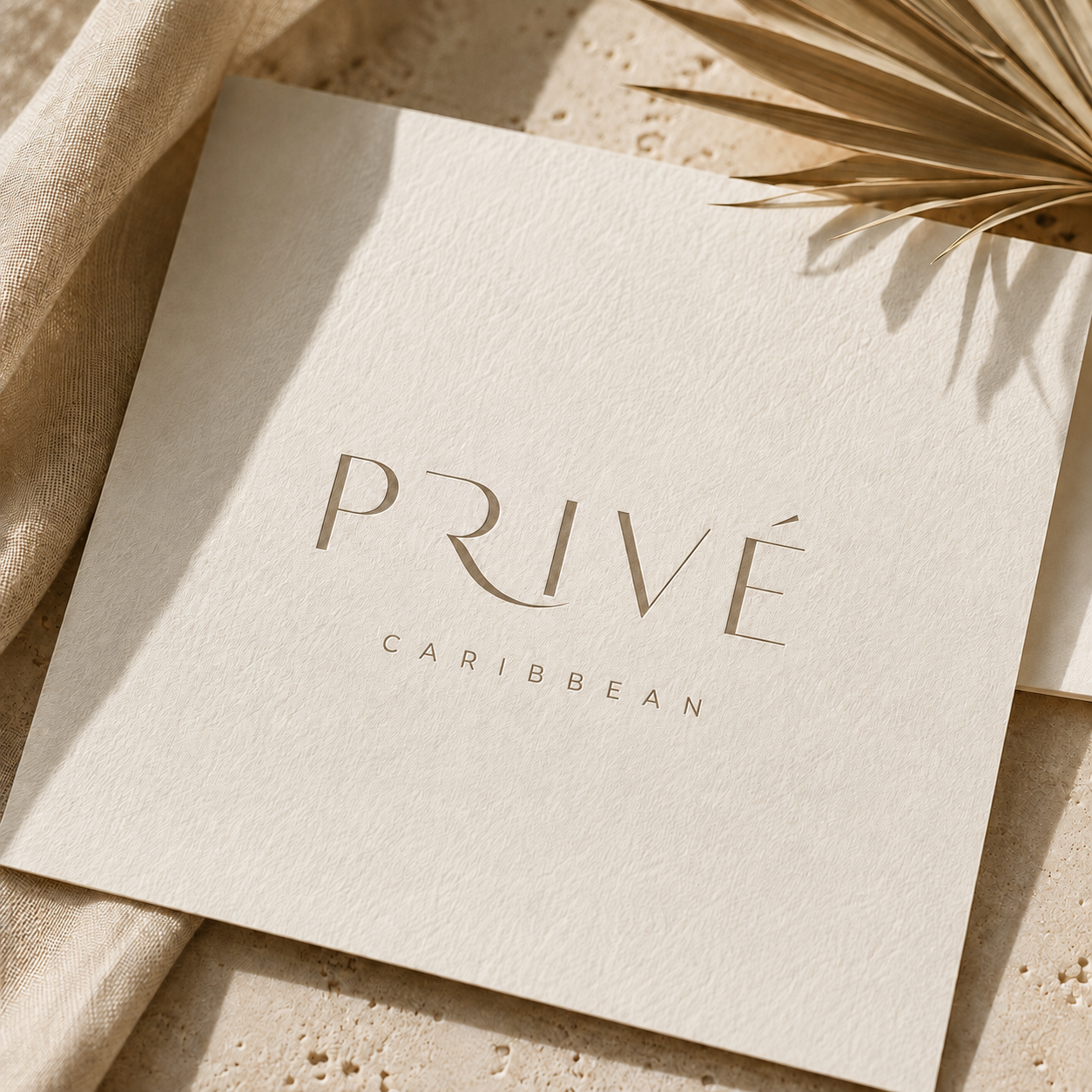 Privé Caribbean brand card embossed with the logo on textured cotton paper