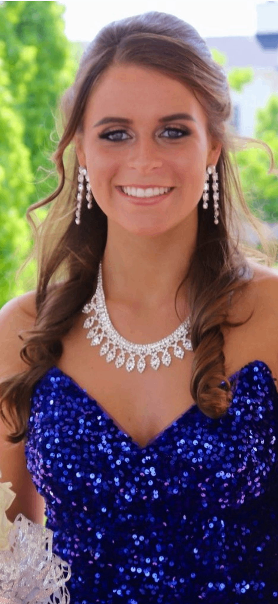 Smiling patient in blue sequin dress
