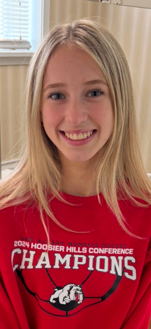 Blonde patient in red Champions shirt
