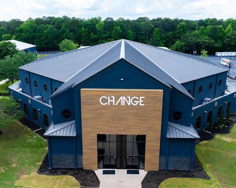 Change Church modern blue building with CHANGE sign
