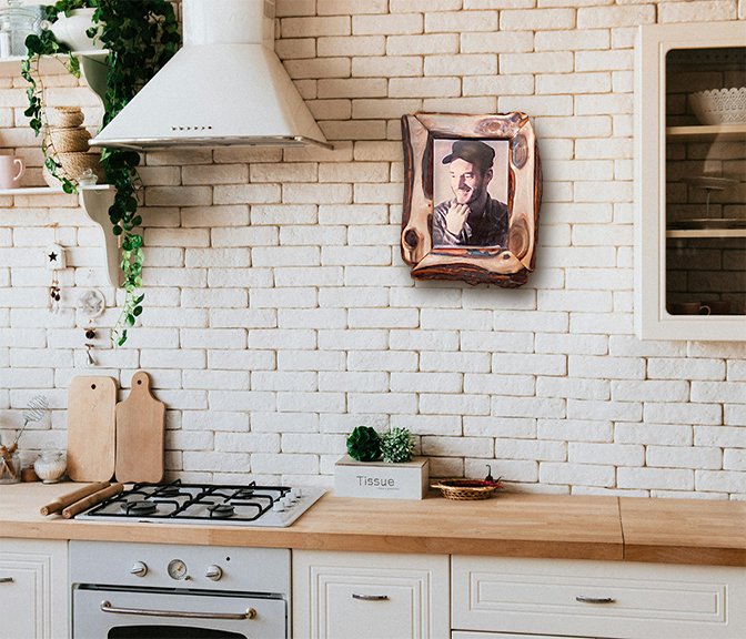 Picture frames arranged on a wall