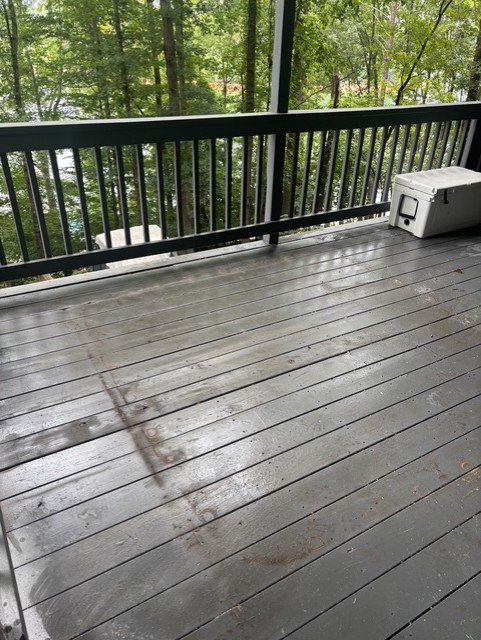 Deck after junk removal — clean wooden deck