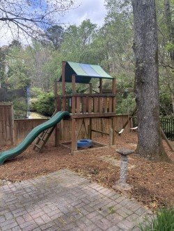 Playground equipment in yard ready for removal