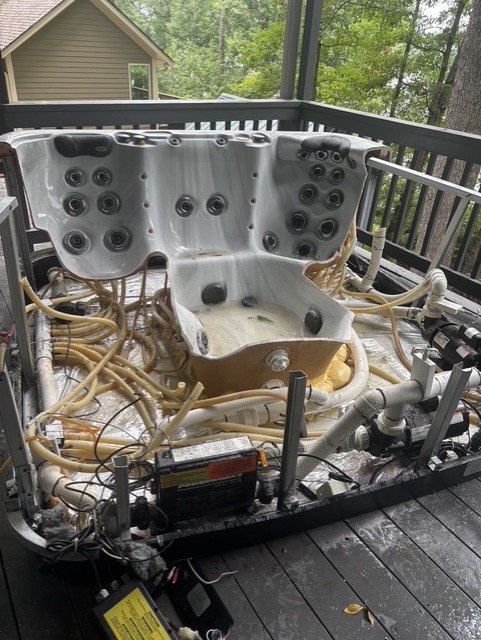 Hot tub removal — interior view of empty hot tub shell