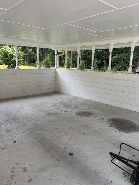 Empty carport space after professional junk removal