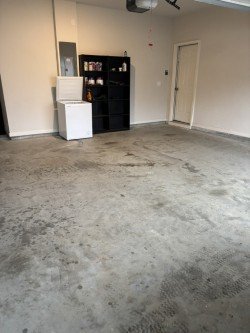 Empty, clean garage space ready for use after professional junk removal