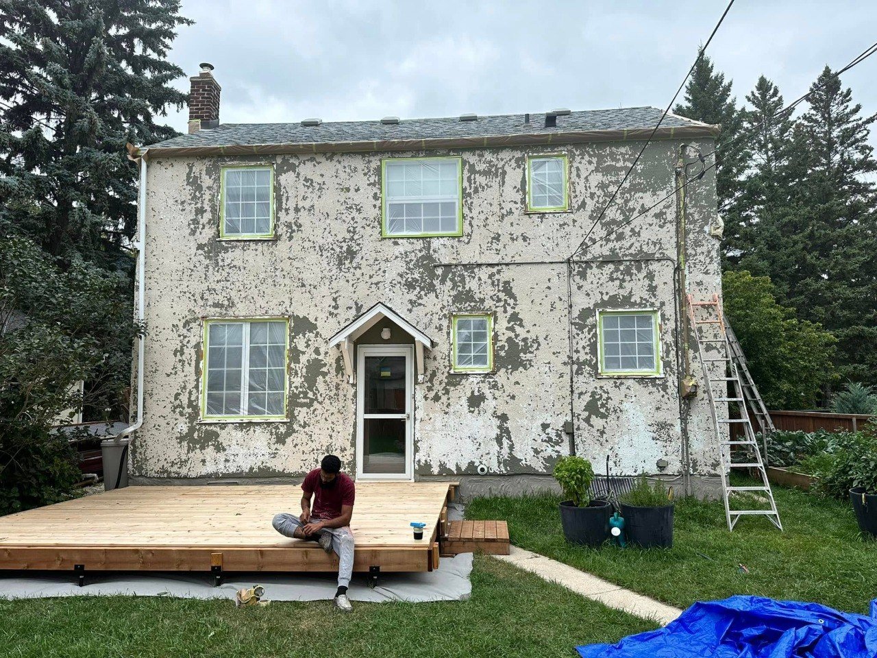 Older house prepared for exterior repainting