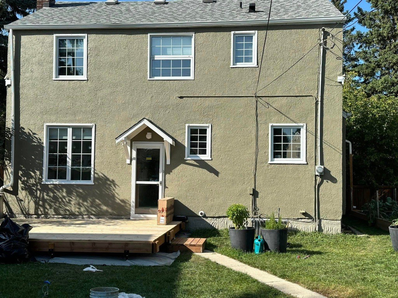 Beige duplex with a completed exterior paint job