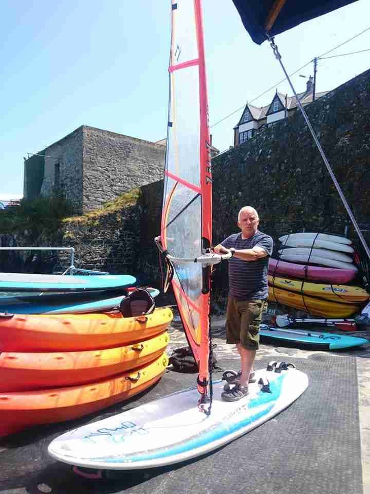 Robin windsurfing on a foil board