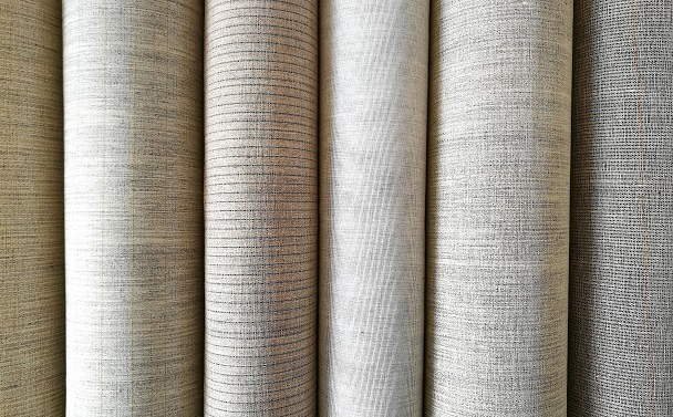 Natural woven hair interlining textiles arranged on a worktable