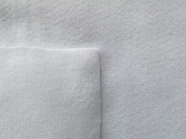 Hair and wool blend needle-punched felt roll with visible fiber texture