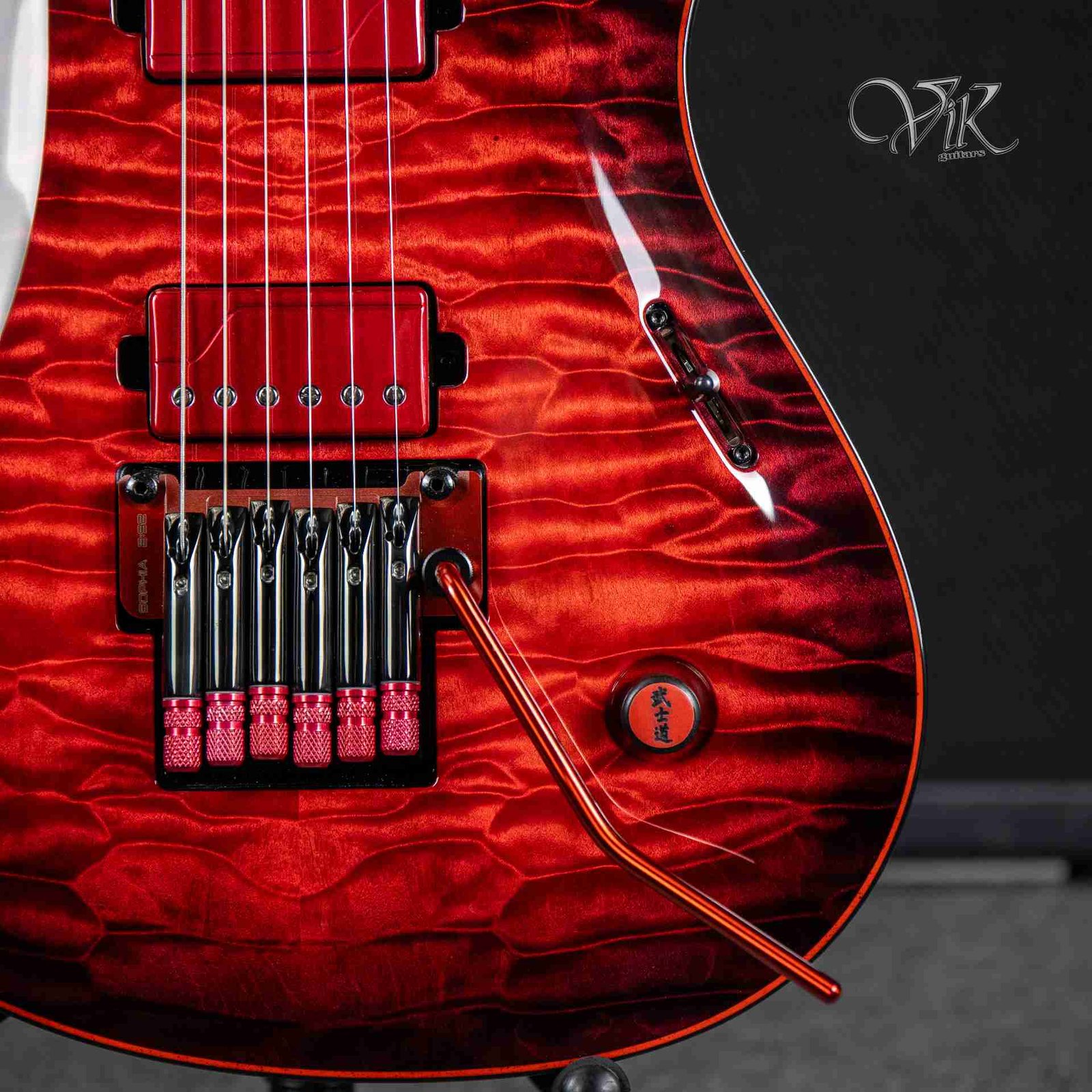 Crimson Tide. This deep red quilt is simply mesmerizing. What do you think? #VikGuitars #RedGuitar #QuiltedMaple #LuthierArt