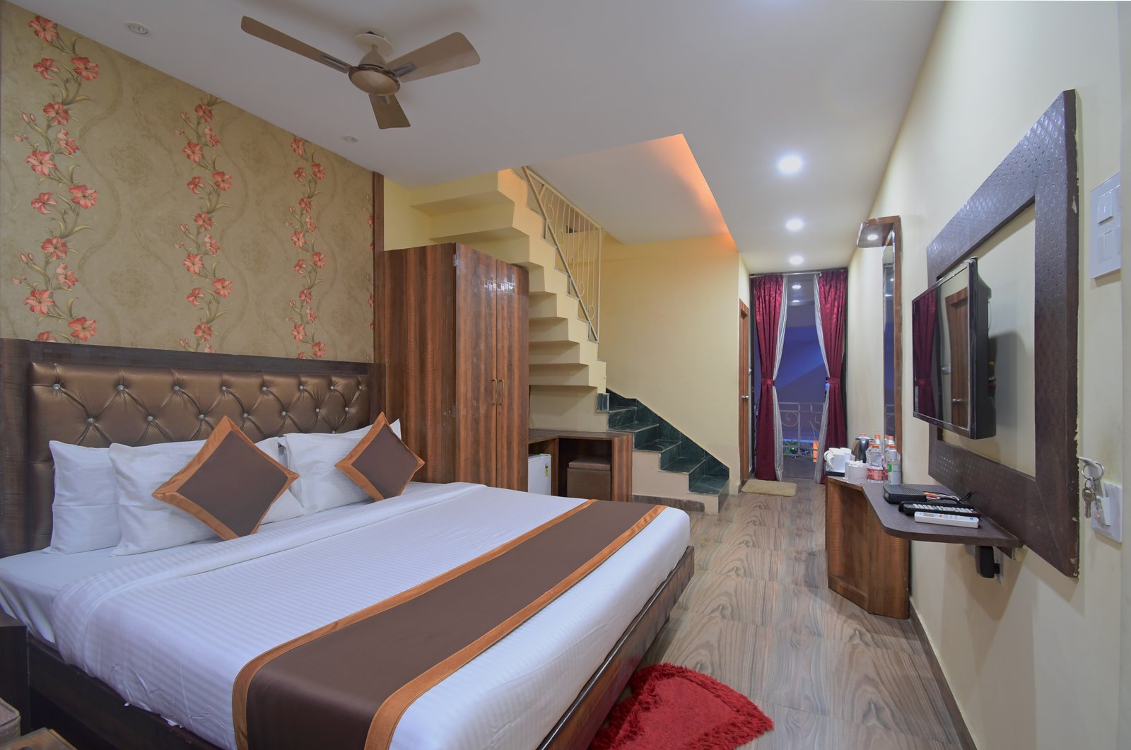 Luxurious king size bedroom in the upper level of the Duplex Room