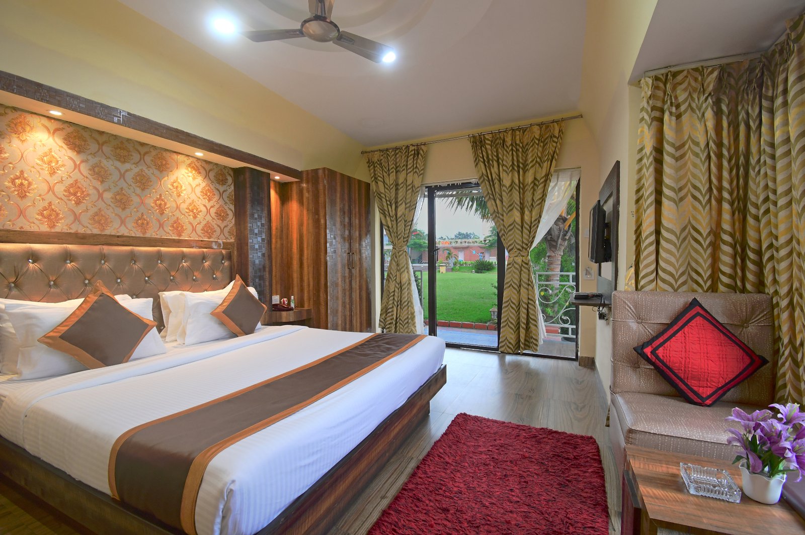Full room view showcasing the king bed and sofa arrangement
