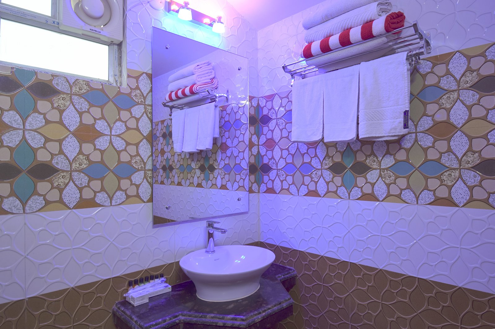Guest Dorm bathroom with white tiles and modern fixtures