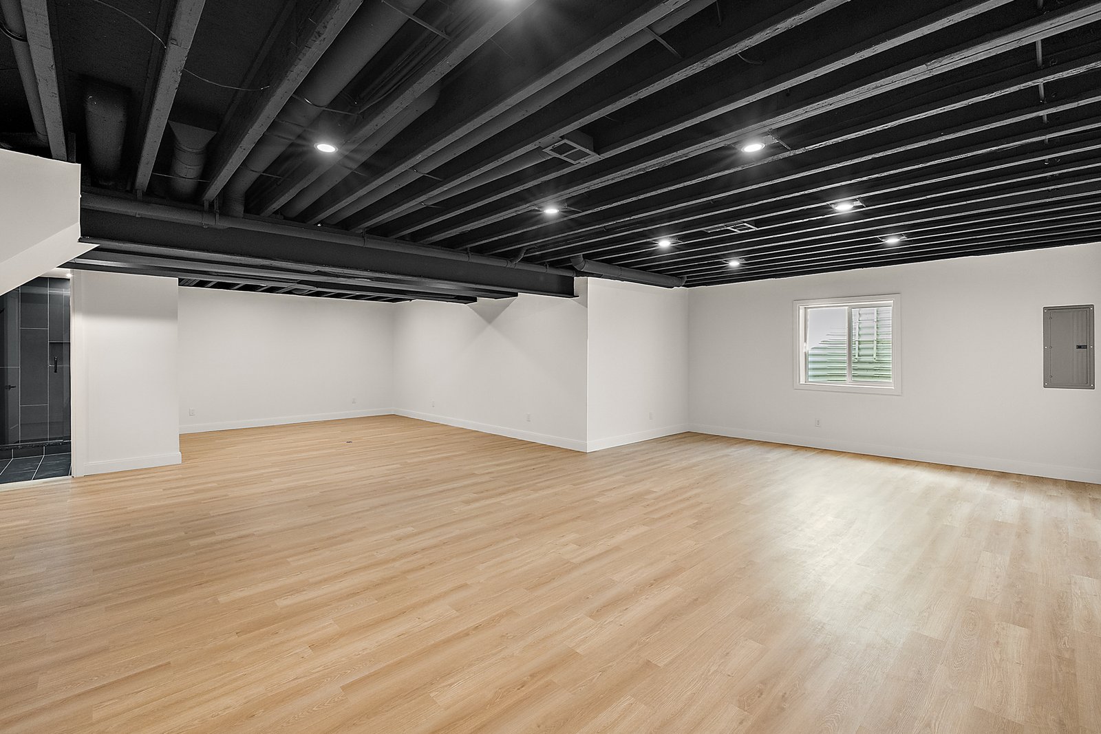 Finished basement living space with recessed lighting in Macomb County Michigan