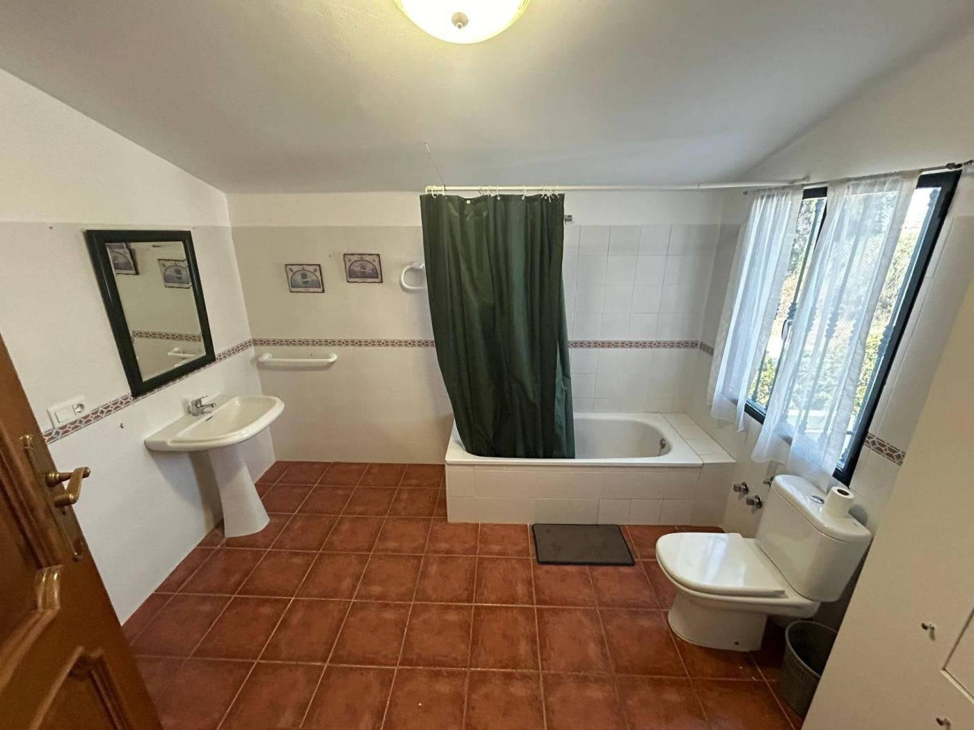 Full bathroom with a bathtub at Cortijo La Vega
