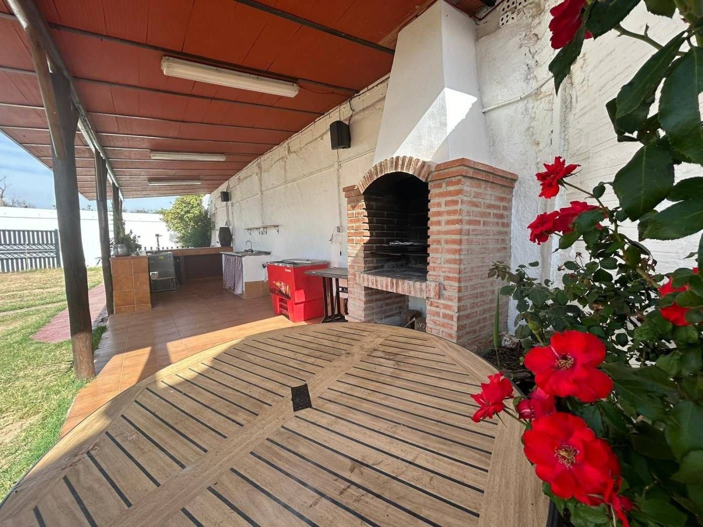 Porch with brick barbecue and outdoor kitchen