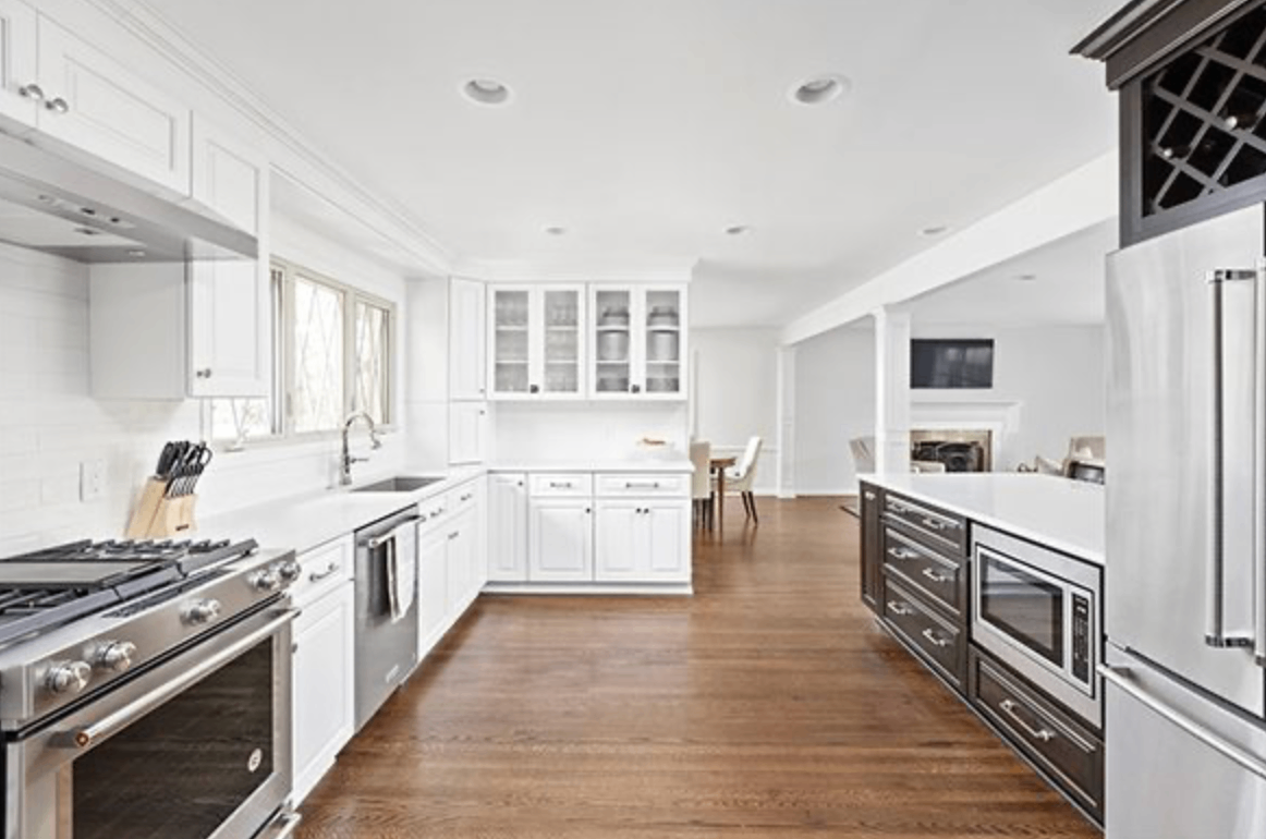 Modern kitchen interior detail in Nicholasville home, featuring white cabinetry and stainless steel appliances