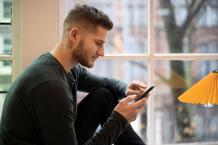 Woman checking phone with a subtle smile