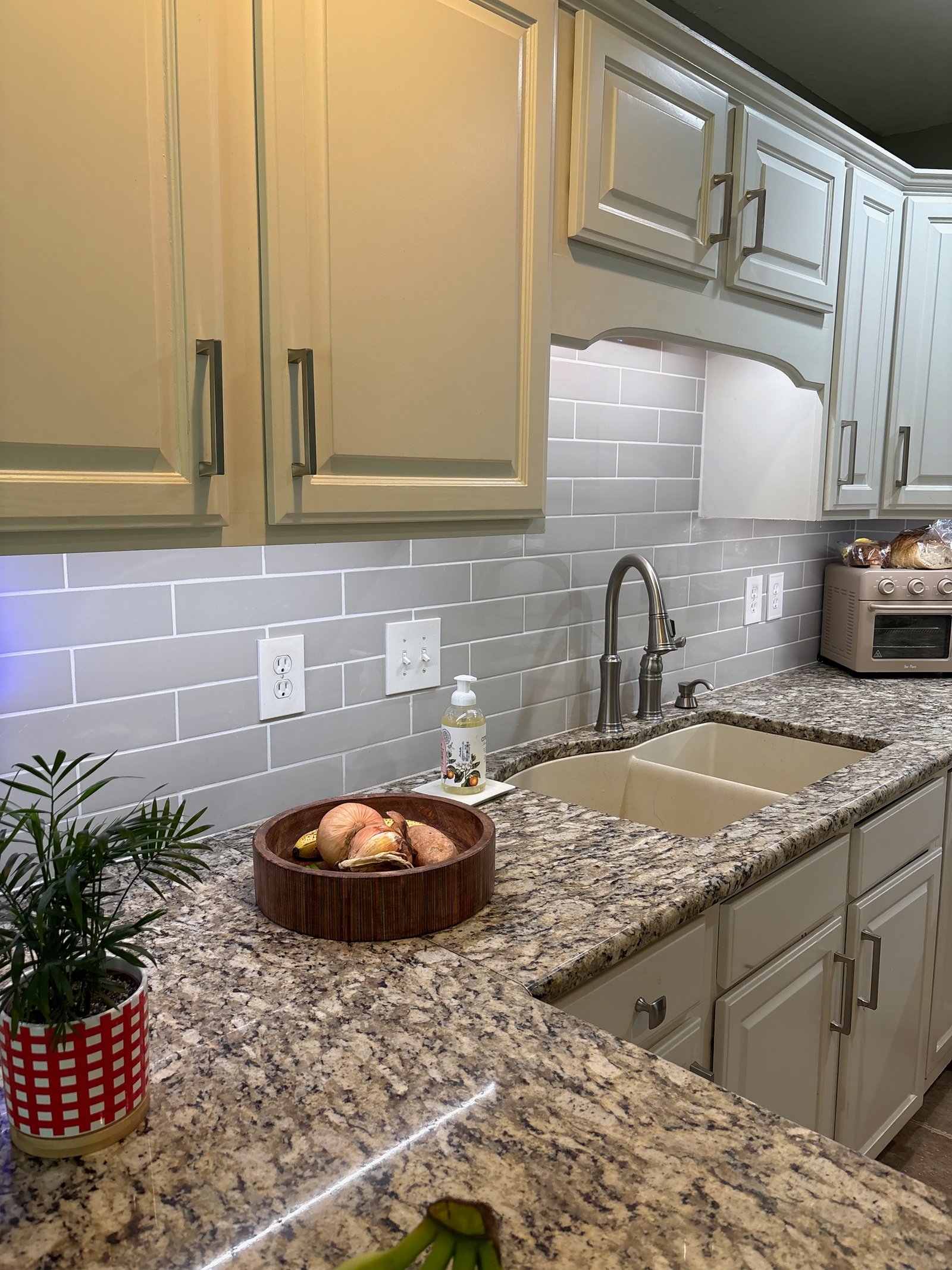 Kitchen tile installation and under-cabinet lighting finished work, no people
