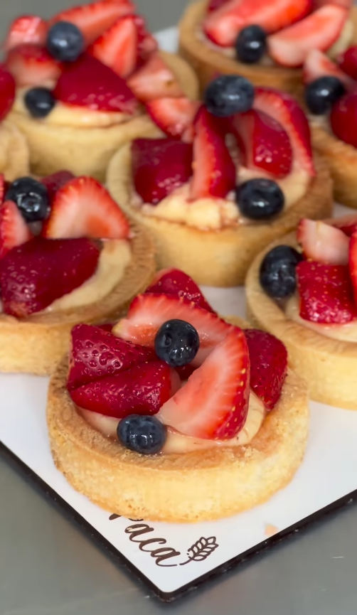 Assorted fresh fruit tarts with berries