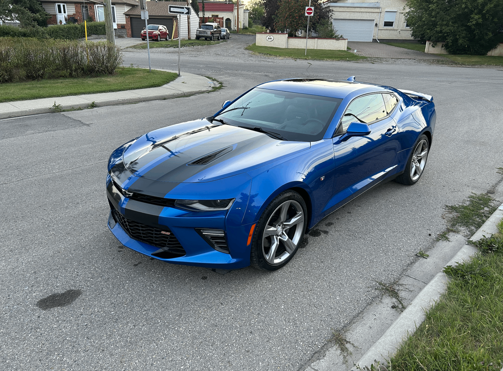 Blue Chevrolet Camaro with black racing stripes