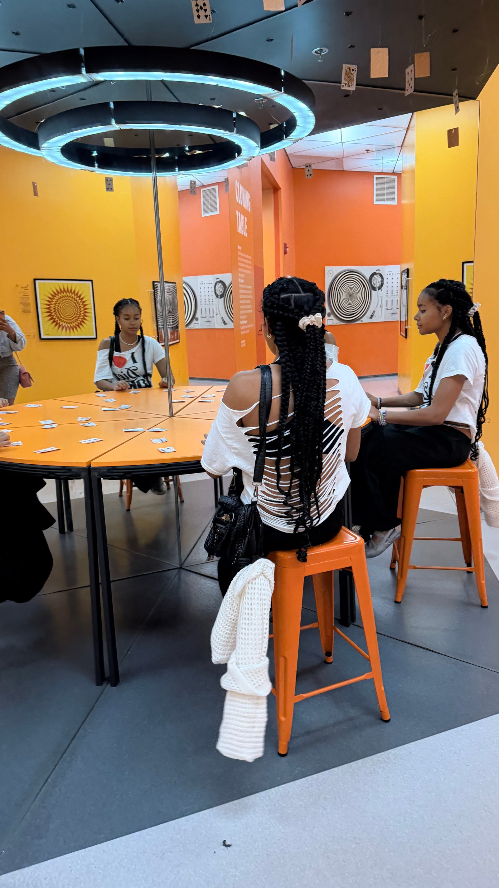 Children exploring a bright, hands-on museum exhibit