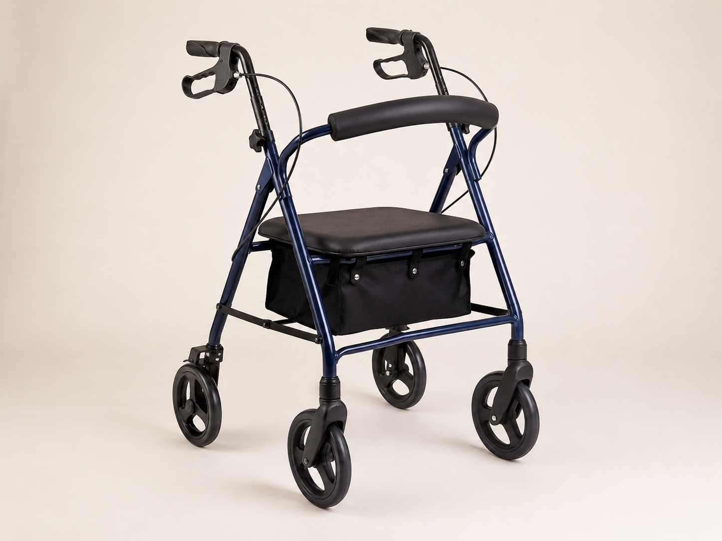 Empty navy four-wheel rollator with seat, backrest, hand brakes, and storage bag
