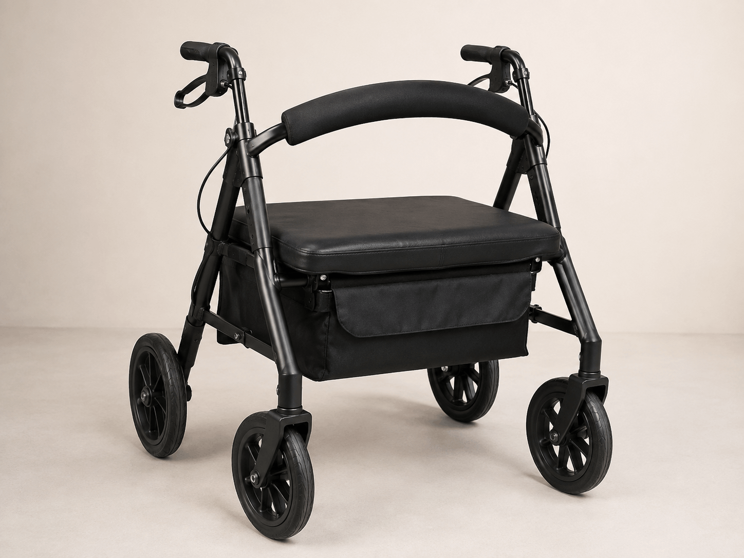 Empty black heavy-duty four-wheel rollator with an extra-wide seat and reinforced frame