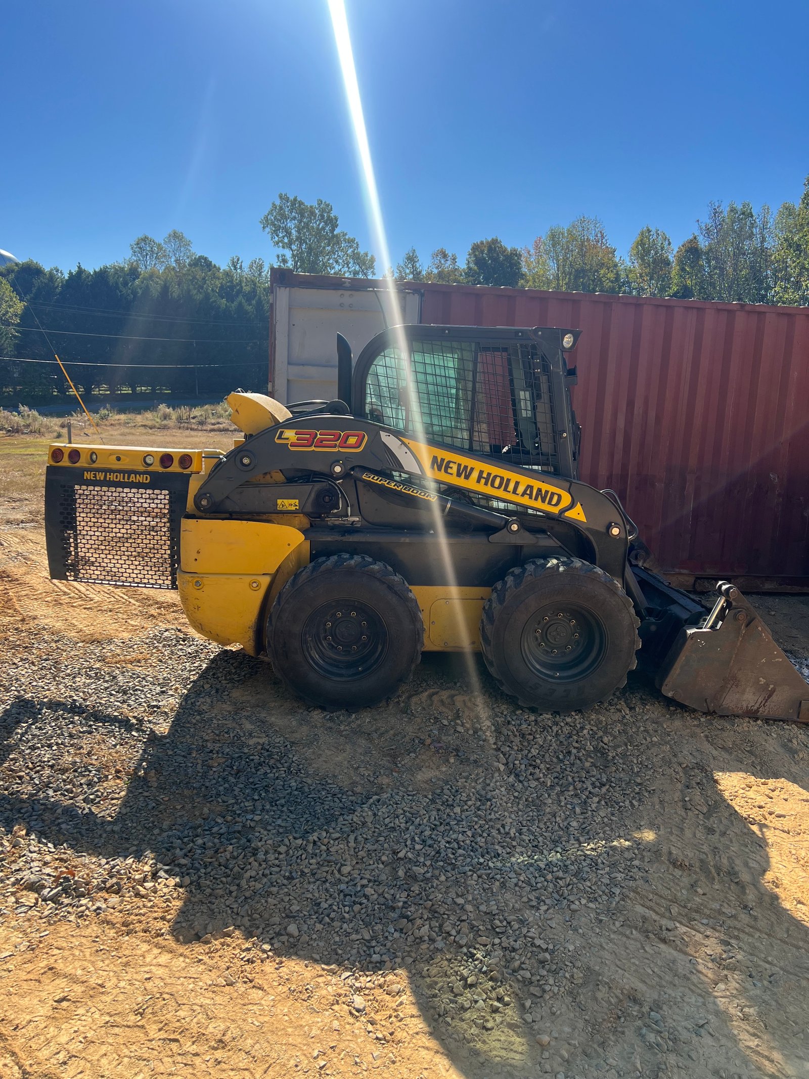 2021 New Holland L320 vertical-lift skid steer loader at a job site, the machine repaired at Maples Diesel in Albemarle, NC
