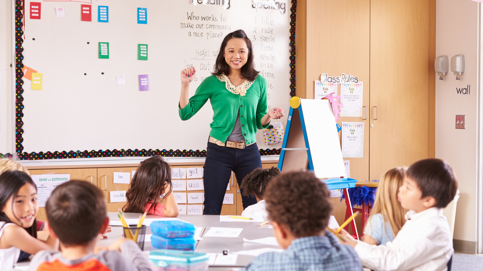 Teacher leading a classroom lesson with students