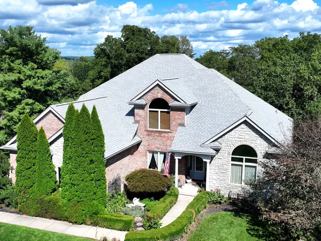 Drone view of a finished XPRO ELITE roof replacement on a brick home in Springboro, Ohio