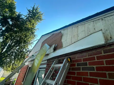 Damaged gable siding and soffit being removed for replacement on a Kettering, Ohio home