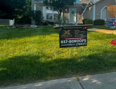 XPRO ELITE yard sign with GAF and BBB logos in front of a Franklin, Ohio roofing job