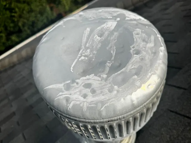 Hail dents across the top of a metal roof vent cap found during an inspection in Miamisburg, Ohio