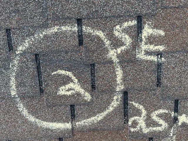 Chalk circle marking a hail hit on asphalt shingles during an XPRO ELITE storm inspection in West Carrollton, Ohio