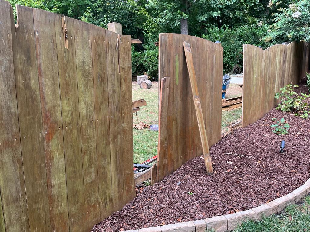 Old fence panels before replacement