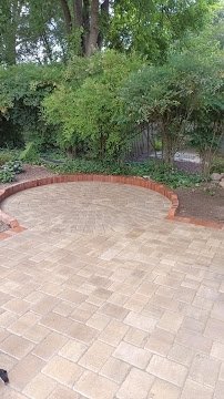 Circular patio with brick soldier-course border
