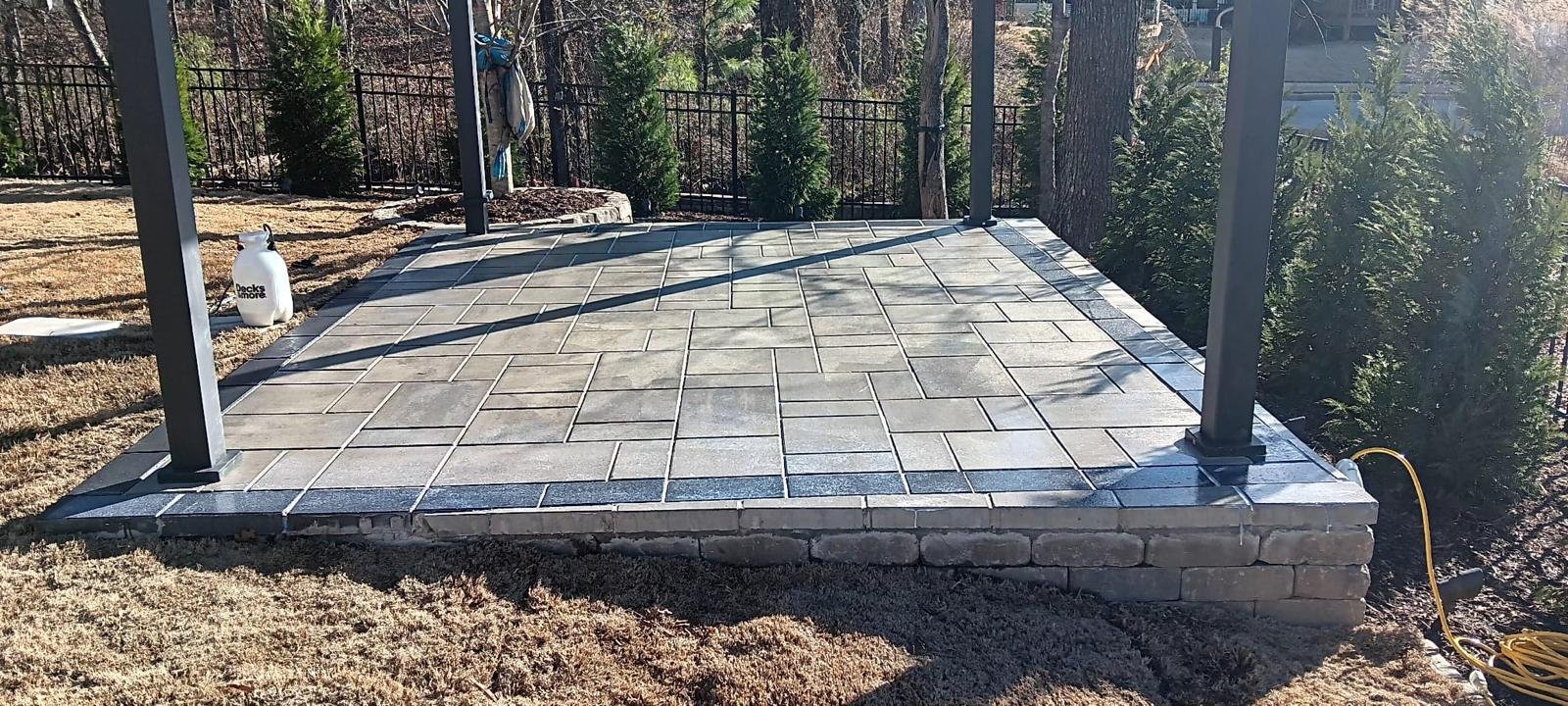 Professional patio with pavers and retaining wall