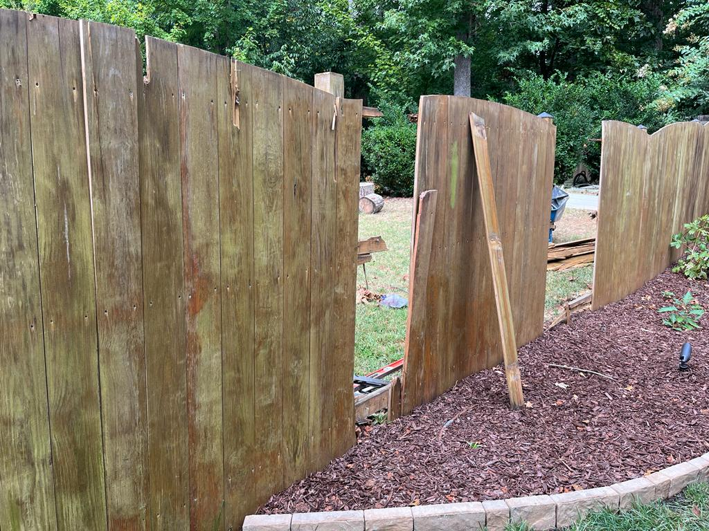 Damaged fence before new installation
