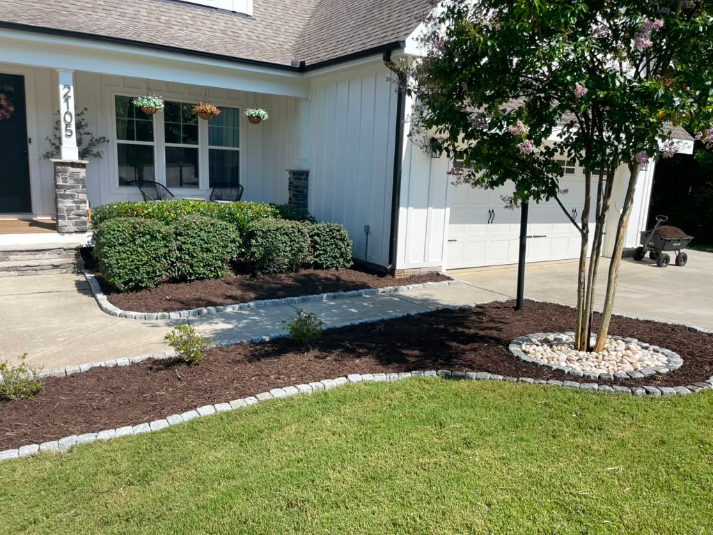 Modern home with professional shrub plantings and mulch beds