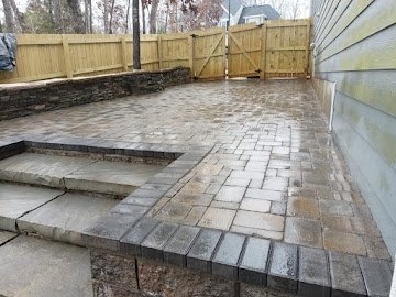 Patio with paver steps and dual-tone borders