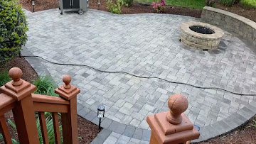 Backyard fire pit gathering space with seating
