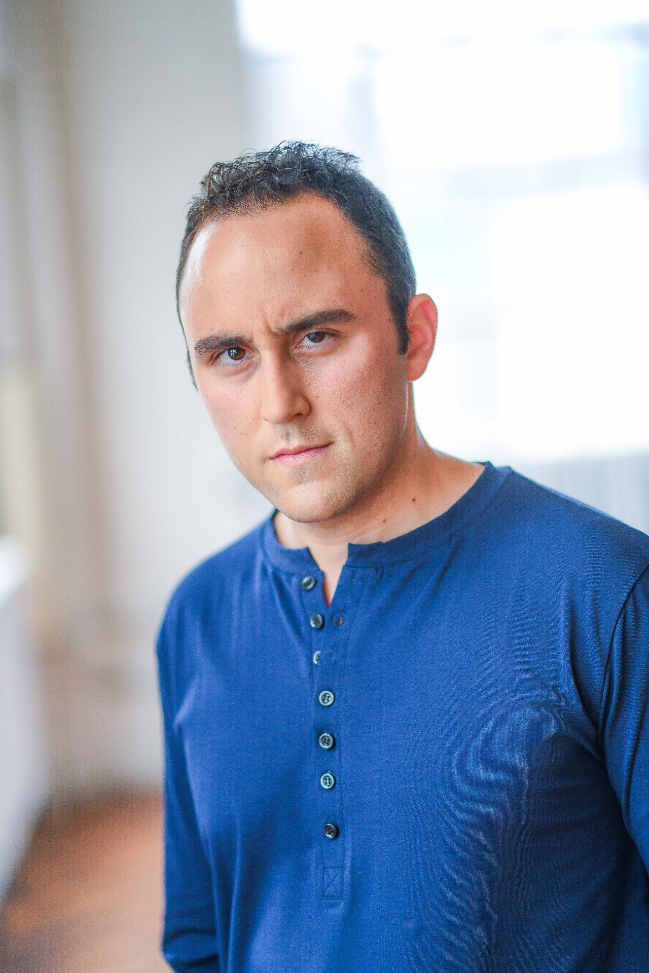 Adam Joseph Turner dramatic three-quarter portrait in a blue henley